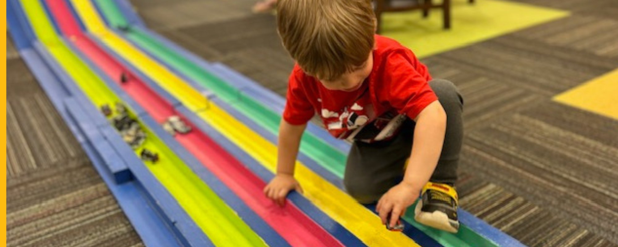 child playing on racetrack