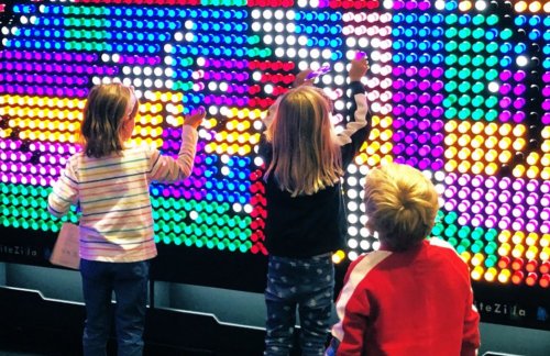 kids at light wall playing